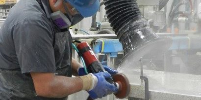 A worker wearing protective equipment to protect from silica dust. Photo by NIOSH